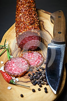 Dried salami crusted in ground red pepper