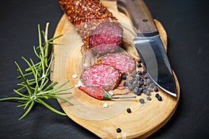 Dried salami crusted in ground red pepper