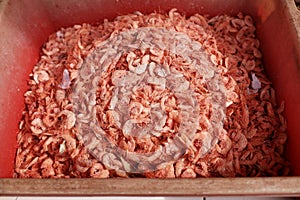 Dried or salted dried shrimps in a red basket, preserved food