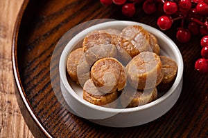 Dried scallop on wooden table