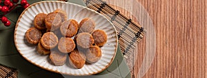 Dried scallop on wooden table