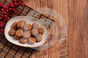 Dried scallop on wooden table photo