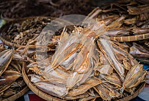 Dried sea fish are sold at a seafood market at Laem Chabang Fishing Village