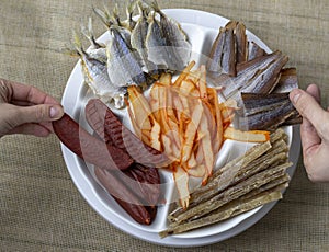 Dried Seafood Mix with Squid, Mussels, Tuna, Yellow Minke, Dried Caviar. Top View. Cured Dehydrated Fish Fillet as Beer