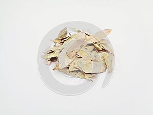 Dried Senna Alexandrina also called daun jati tiongkok, daun jati china leaves with white background. This leaves usually used a