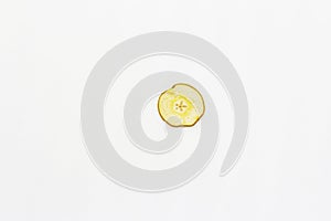 Dried single slice of pear  on white background
