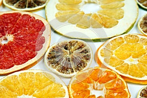 Dried slices of various citrus fruits on white backgroun