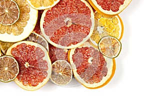 Dried slices of various citrus fruits on white background