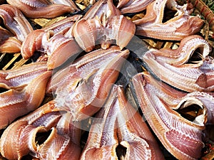 Dried snakehead fish on bamboo basket in air sun for dried