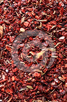 Dried spices background: paprika and red chilli pepper with coarse texture for culinary content. Naturalness and