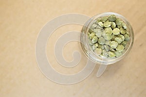 dried split peas in a glass cup
