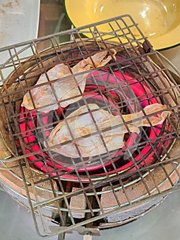 Dried squid grilled on charcoal grill Ready-to-eat food.