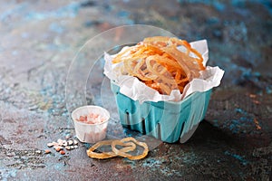 Dried squid rings with spices in a serving ceramic basket