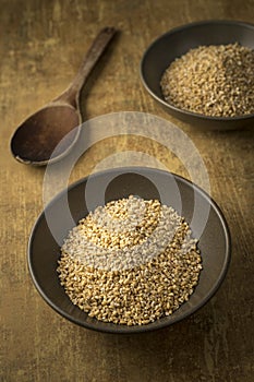 Dried steel cut oats in a bowl photo