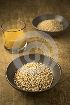 Dried steel cut oats and orange juice photo