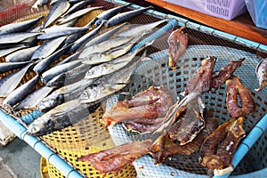 Dried sun fish for food preserves on wire sieve at outdoor for sale customer in local market shop of Ban Bang Krachao fishing