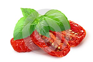 Dried or Sundried tomato halves with   basil isolated