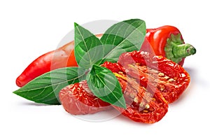 Dried or Sundried tomato halves with chile  pepper and basil isolated