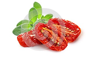 Dried or Sundried tomato halves with sweet  basil isolated