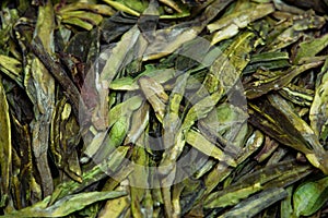 Dried tea leaves closeup as background