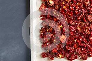 Dried tomatoes dried on a pan. Top view.