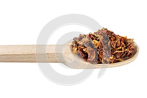 Dried tomatoes in wooden spoon isolated on white background. spices and food ingredients. spices and food ingredients