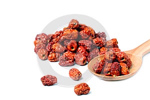 Dried unabi fruit or jujube in wood bowl of on white background. Chinese dried red date fruit. copy space for text
