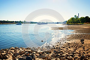 Dried up river bed, beach. Low water level of the Rhein dry river landscape, photo On the banks of the Rhine dried out in Cologne