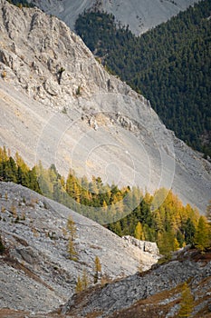 Dried up river bed in a rural countryside with the mountains in the background. Majestic landscape with the rock road and hills