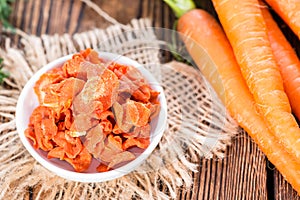 Dried vegetables (Carrots) on wood photo