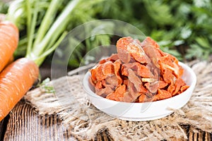 Dried vegetables (Carrots) on wood photo