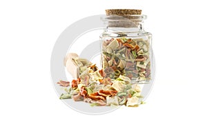 Dried vegetables or soup vegetables in wooden scoop and jar on isolated on white background. front view. spices and food ingredien