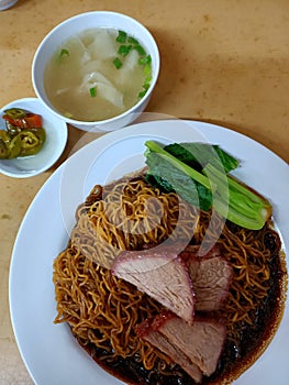 Dried Wantan mee with barbeque pork photo