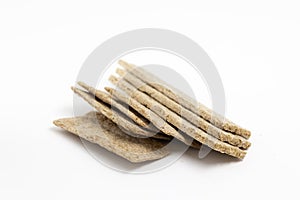 Dried wheat dietary light brown bread on a white background