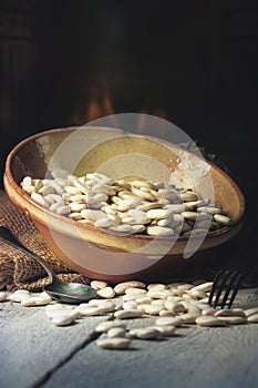 Dried white Beans on a table in a warm kitchen