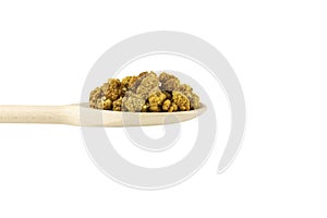 Dried white mulberry fruit - latin Morus alba -  on wooden spoon isolated on white background. Spices and food ingredients