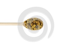 dried white mulberry fruit - latin Morus alba - on wooden spoon isolated on white background. Spices and food ingredients