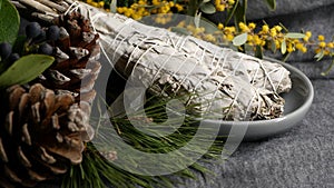 Dried white sage smudge stick, relaxation and aromatherapy. Smudging during psychic occult ceremony, herbal healing, yoga or aura