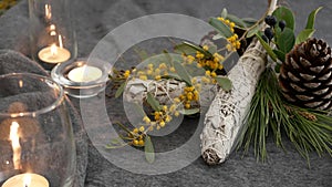 Dried white sage smudge stick, relaxation and aromatherapy. Smudging during psychic occult ceremony, herbal healing, yoga or aura photo