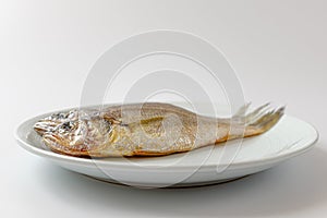 Dried yellow croaker on a white background
