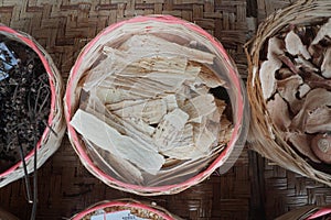 Dried Zingiber cassumunar Roxb in bamboo basket. medicinal plants. Thai herbs.