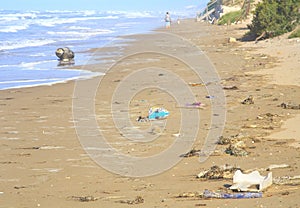 Drifted plastic waste on a beach in the mediterranean pollution of the ocean with microplastics,environment protection