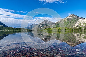 Driftwood Beach wide angle shot with colorful rocks in Waterton Lakes National Park Canada photo
