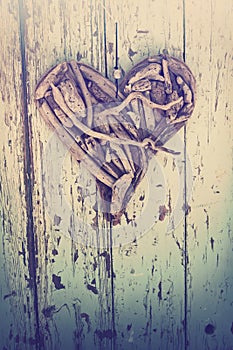 Driftwood heart on vintage wall