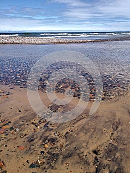 Driftwood Waves Pebbles Stones beach Rocks clear fresh Lake sea water bridge blue wet