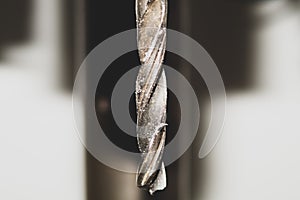 Drill bit of a drilling machine close up. working tool