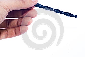 Drill bit in hand on an isolated white background.