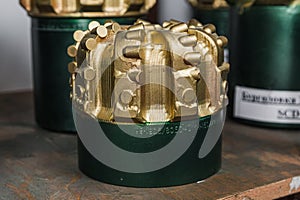 Drill bit on shelving in stock. Oil drilling equipment for drilling rig operation on oil platform in oil and gas