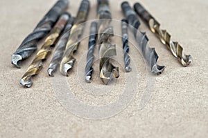 Different Types of Drill Bits. Old and worn-out drill bits in various sizes