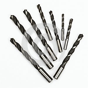 Drill bits isolated on white background. Top view. Flat lay.